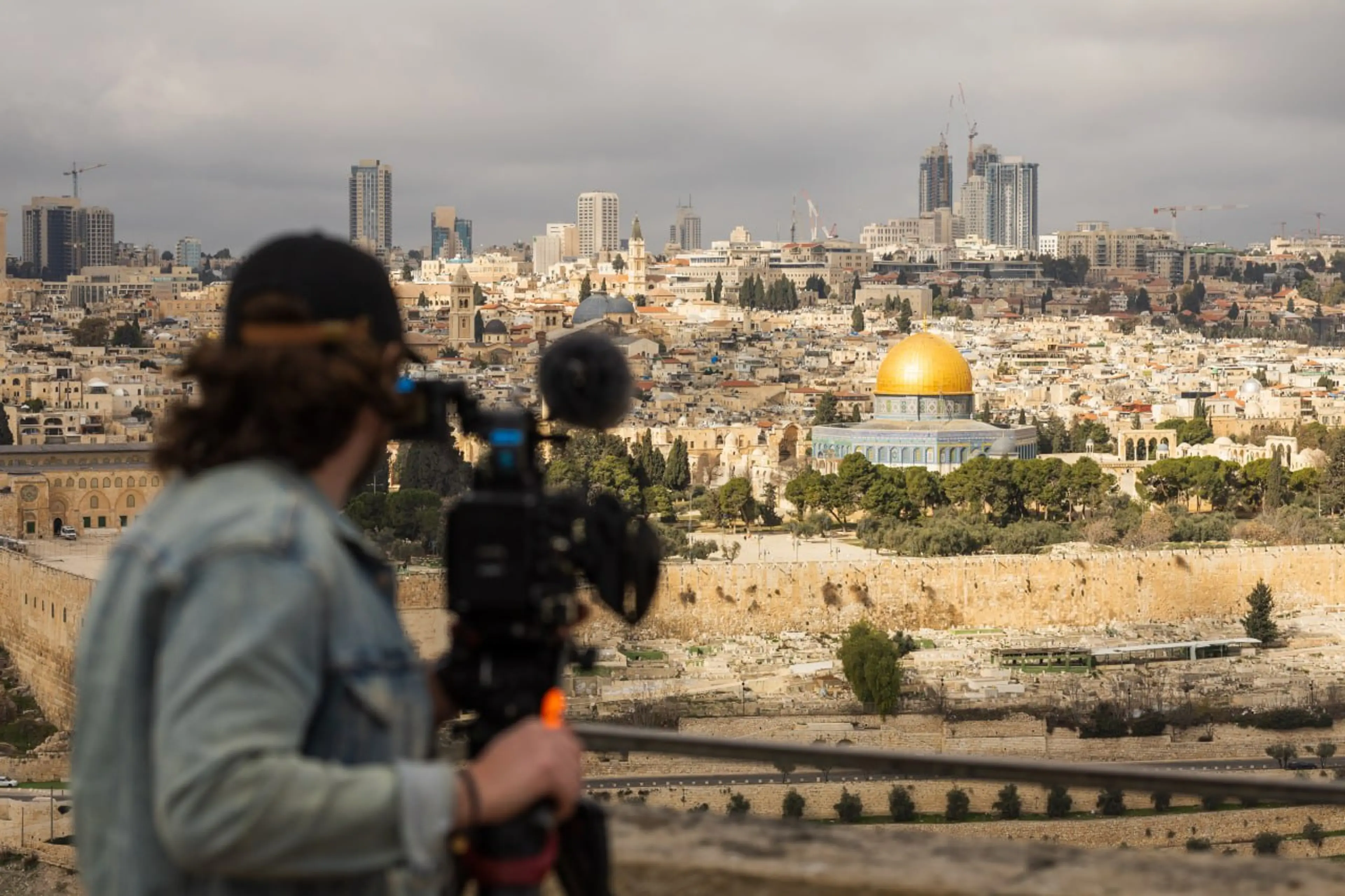 Cameraman filming Jerusalem skyline
